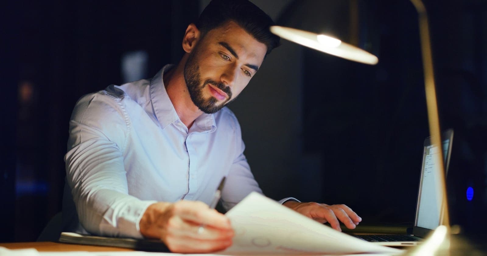 Reading a business contract closely before signing it