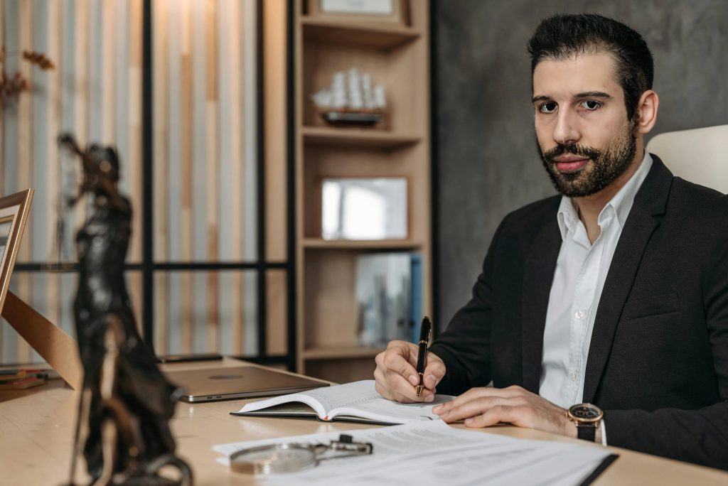 Attorney Nicholas Costaras of Costaras Law at his desk, focused on estate planning, business formation, business contracts, and mergers & acquisitions, demonstrating his commitment to providing expert legal services.