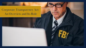 FBI agent working on a laptop, representing the Corporate Transparency Act and its role in business compliance and enforcement.